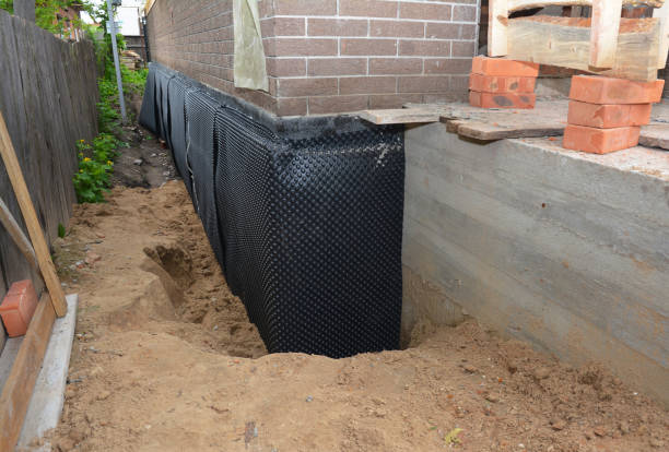Happy homeowners after waterproofing job in Harmans